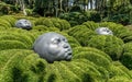 The Gardens of Etretat, installation Ã¢â¬ÅDrops of rainÃ¢â¬Â with giant rubber heads on the boxwood. Normandy, France.